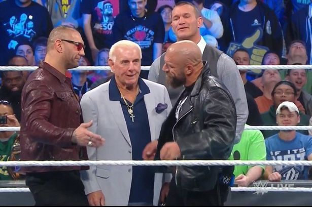 Evolution is shown in the ring on Smackdown 1000 after Batista created tension between himself &amp; Triple H. (Source - WWE)