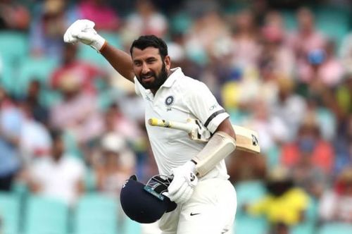 Pujara celebrating his third ton of the series