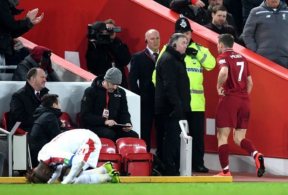 Milner walks off after his second yellow card