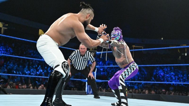 Andrade (left) during his match against Rey Mysterio (right)