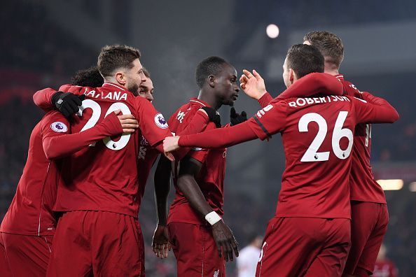 Liverpool FC players celebrate after scoring against Crystal Palace in the Premier League