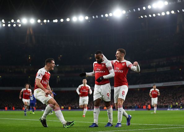 Granit Xhaka (l) and Aaron Ramsey (r) celebrates Alexandre Lacazette