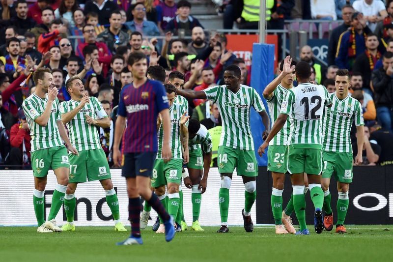 Real Betis players celebrating a goal against Barcelona