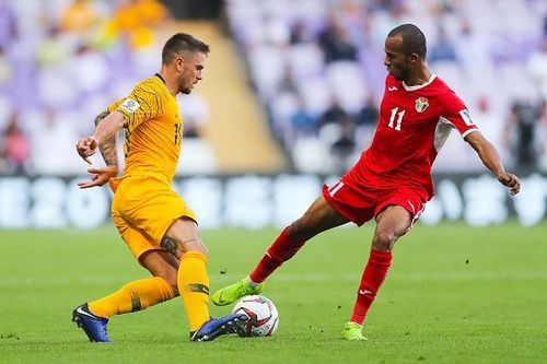 Jordan's Yaseen Al-Bakhit in the red jersey