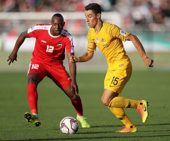 Palestine's Khaled Salem in the red jersey would look to score against Jordan