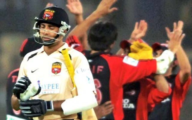 VVS Laxman walking back to the pavilion after being dismissed