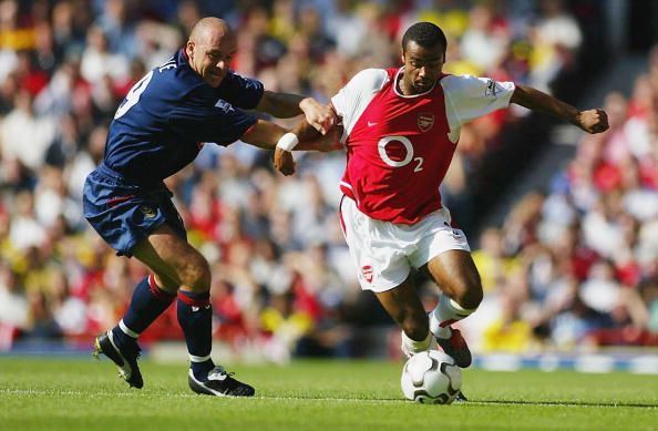 Steve Stone of Portsmouth and Ashley Cole of Arsenal