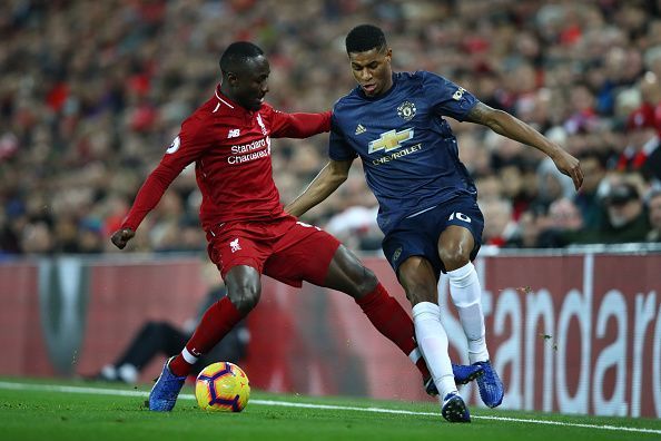 Naby Keita and Marcus Rashford in action