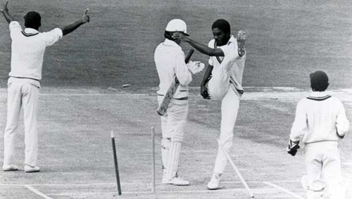 The infamous photograph of Michael Holding kicking the stumps