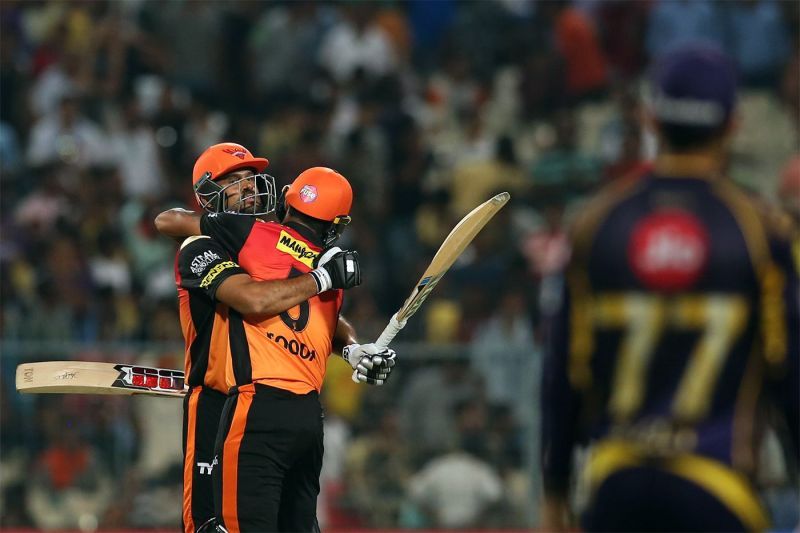 Yusuf Pathan and Deepak Hooda embrace after carrying their team past the finish line.