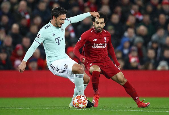 Mats Hummels and Mohamed Salah in action