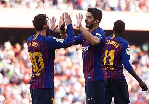 Goal-scorers Lionel Messi and Luis Suarez celebrate