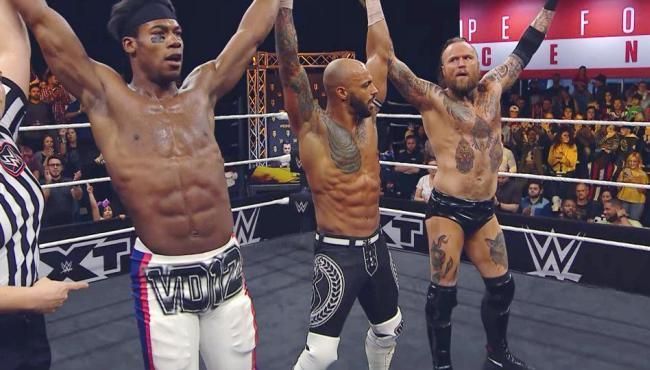 Velveteen Dream, Ricochet, and Alistair Black at Halftime Heat.