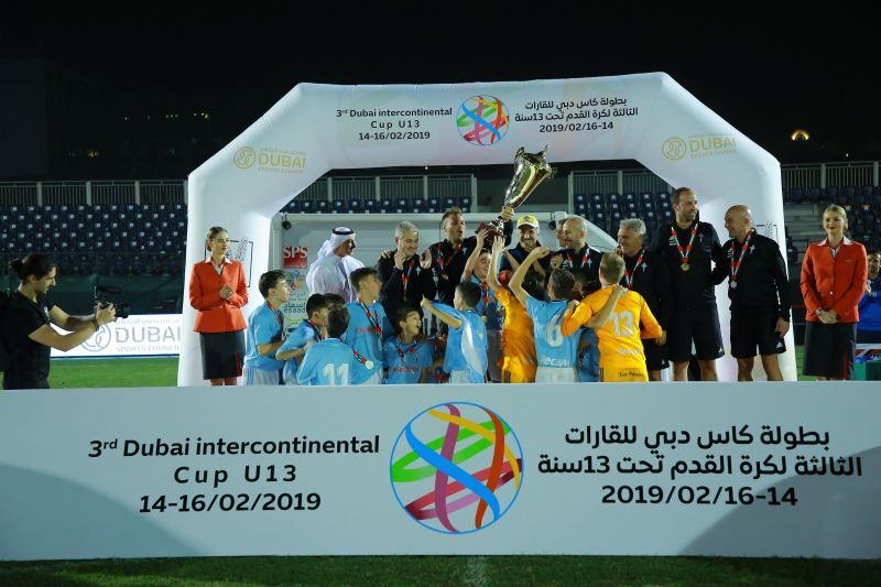 Celta de Vigo players celebrate as they receive the Dubai U13 Intercontinental Cup trophy from HE Saeed Hareb, Secretary General of Dubai Sports Council.