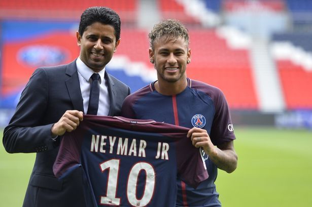 Neymar with Nasser Al Khelaifi upon signing for PSG