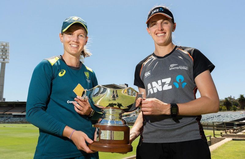 Meg Lanning &amp; Amy Satterthwaite posing with the trophy