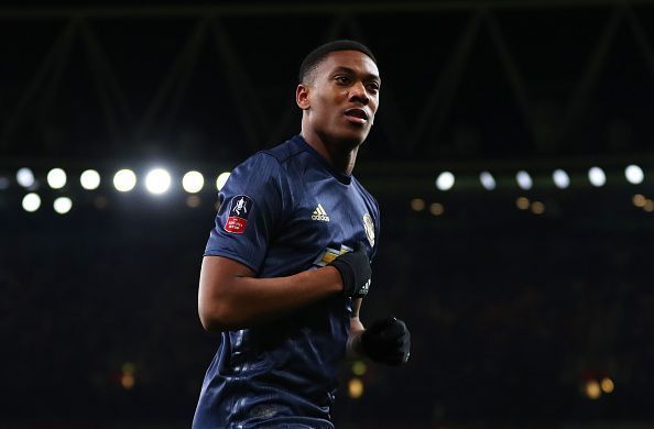 Martial scrapes through to the top 10