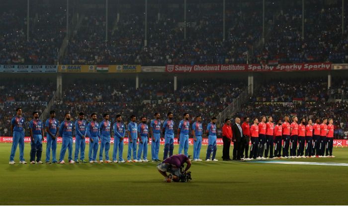 India and England line-up for the national anthem before the game at the Chinnaswamy Stadium in Bangalore.