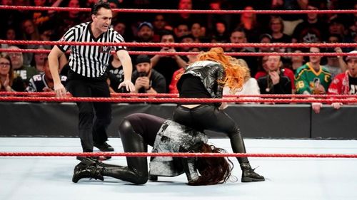 Becky Lynch attacking Stephanie