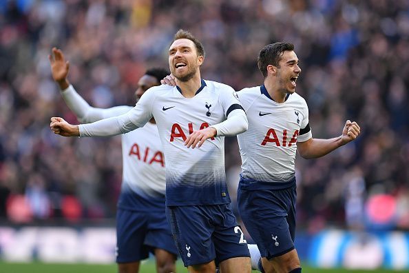 Christian Eriksen celebrates with teammates after scoring against Leicester City
