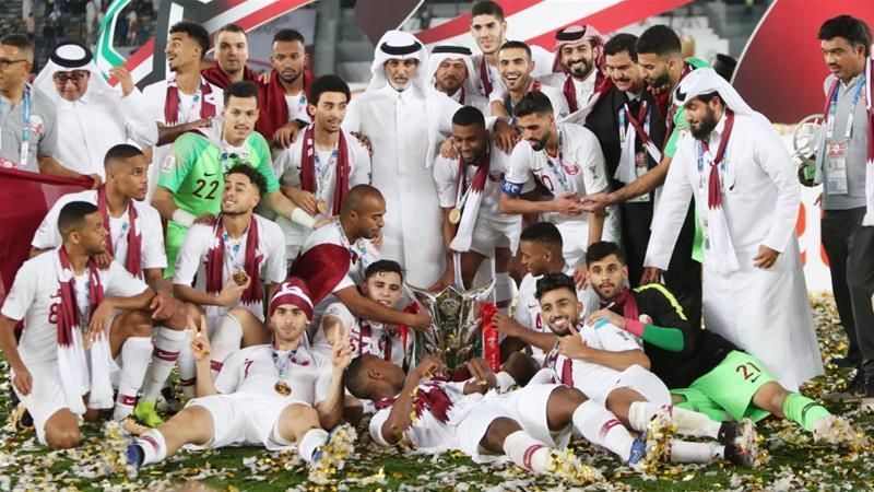 The triumphant Qatar team with the trophy