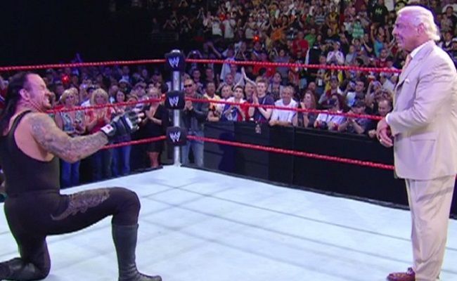 Undertaker bowing down to Ric