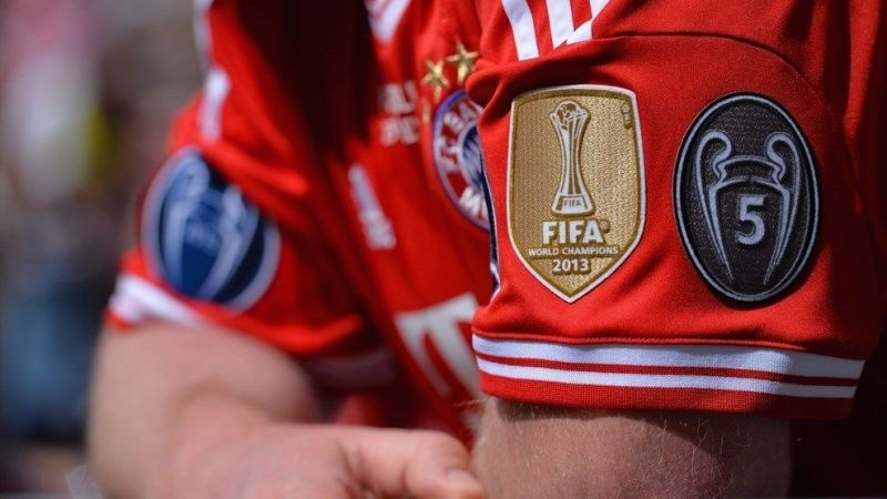 A Bayern Munich fan displaying his replica shirt