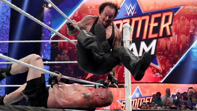 The Undertaker trying to submit Brock Lesnar