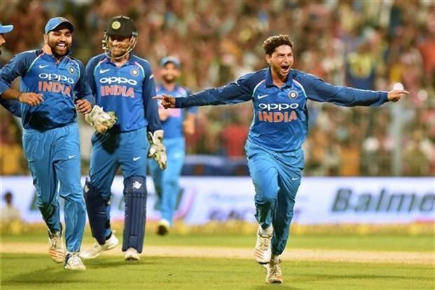 Kuldeep celebrates his hat-trick at the Eden Gardens