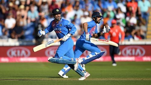 MS Dhoni and Virat Kohli MS Dhoni guiding the team through