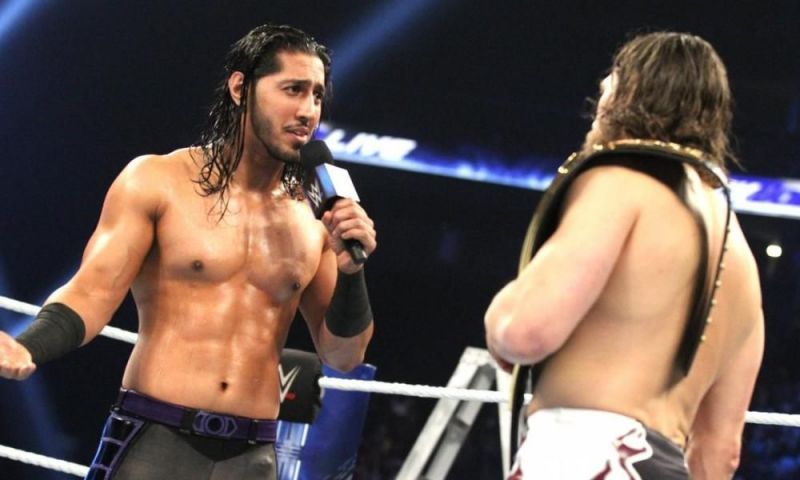 Mustafa Ali facing off WWE Champion Daniel Bryan.