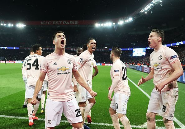 Manchester United players celebrate Marcus Rashford's winner against Paris Saint-Germain.