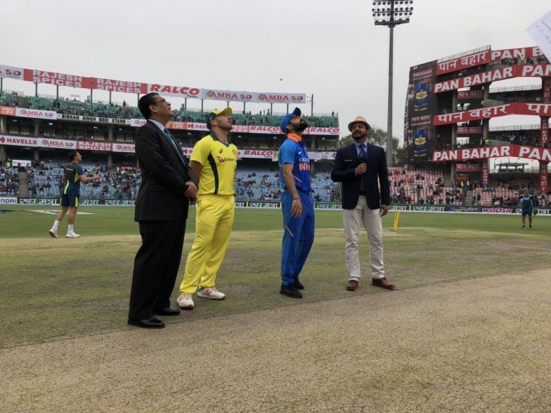 Two captions during toss