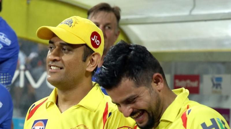 Dhoni and Raina sharing a lighter moment
