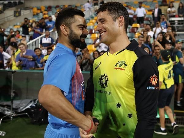 Virat Kohli and Marcus Stoinis sharing a light moment