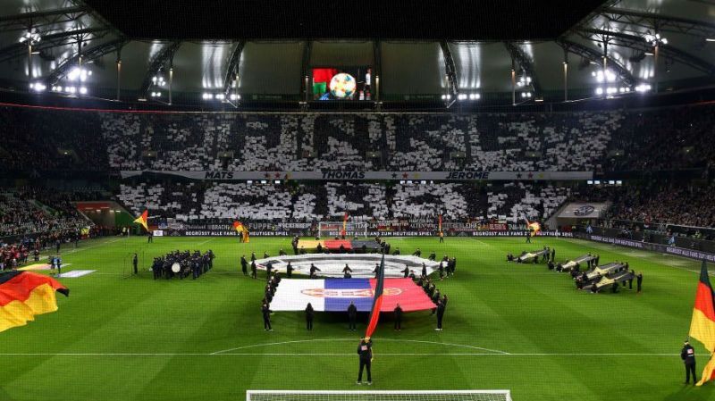 German fans hold up display at the Volkswagen Arena reading 