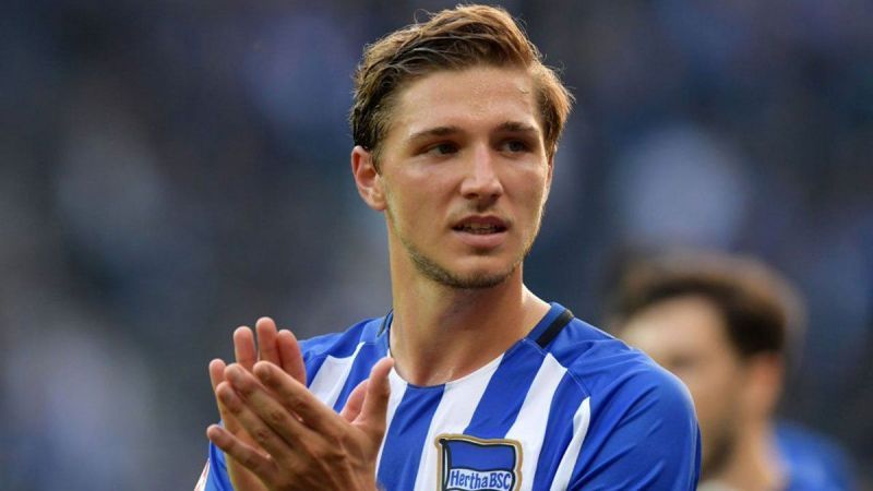 Niklas Stark applauds Hertha Berlin&#039;s fans at the end of a tough game