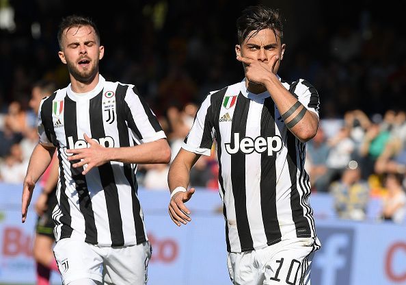 Pjanic and Dybala celebrating a goal