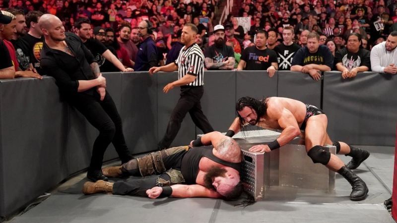 braun strowman beaten by drew mcintyre, bobby lashley and baron corbin