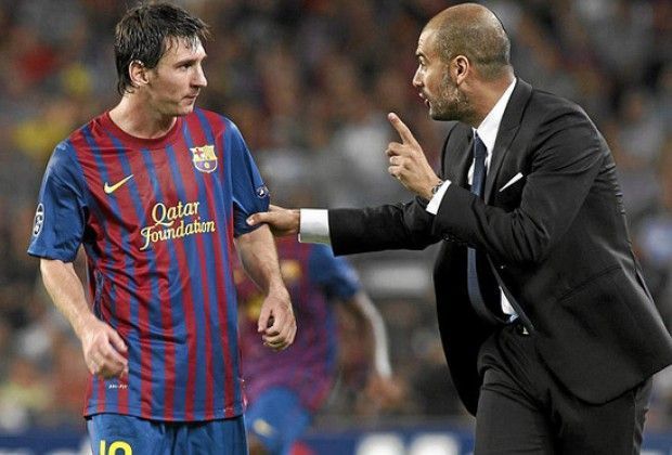 Pep Guardiola with Lionel Messi.