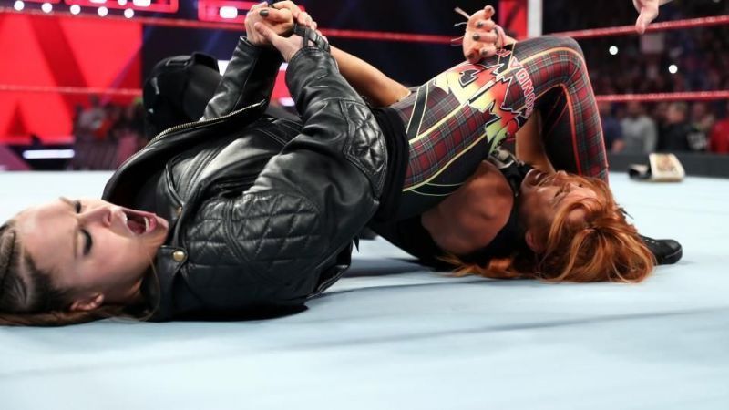 Ronda Rousey to put an end to the match between Charlotte and Becky Lynch