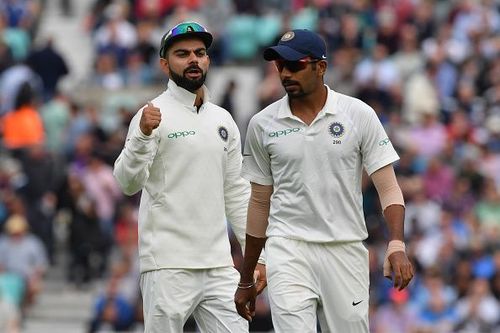 Virat Kohli (L) and Jasprit Bumrah