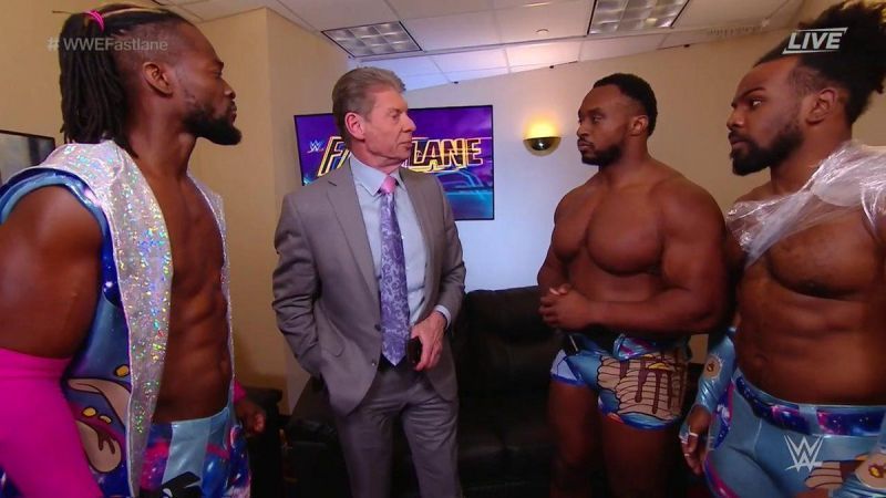 Vince McMahon with all the members of The New Day