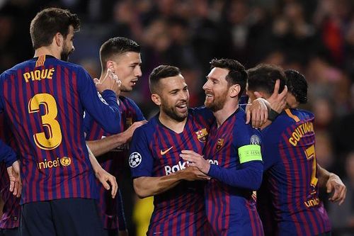 Messi celebrates with his teammates during their 5-1 win over Lyon in the second leg tie