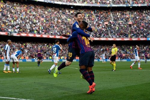 Messi celebrates with substitute Malcom after netting Barca's second goal during their 2-0 win vs Espanyol