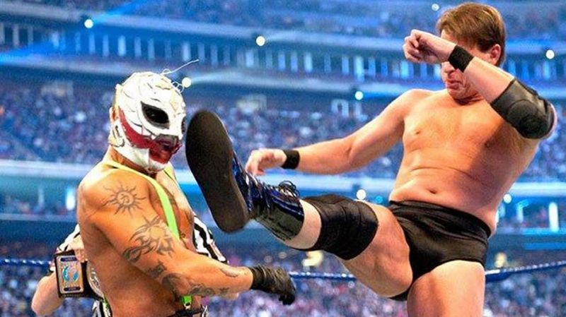 Rey Misterio eats a big boot courtesy of John Bradshaw Layfield