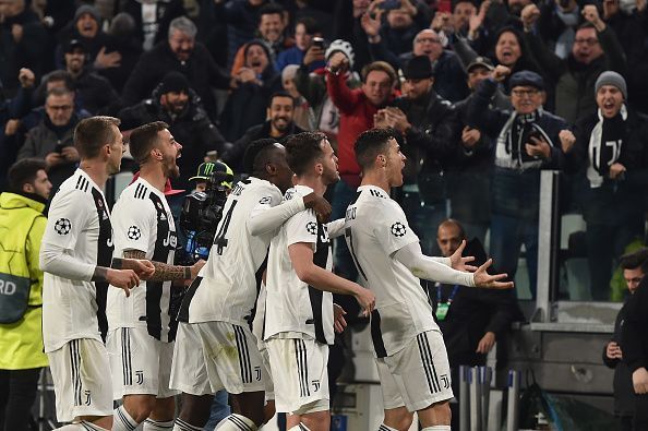 Players celebrate after the third goal