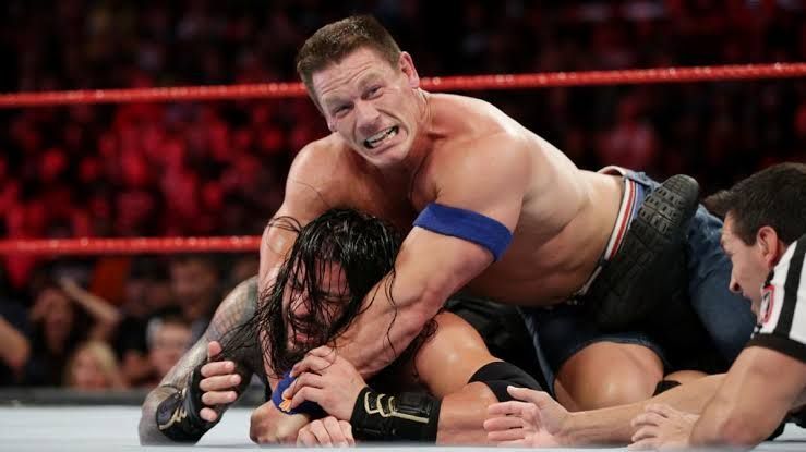 Reigns and Cena in action