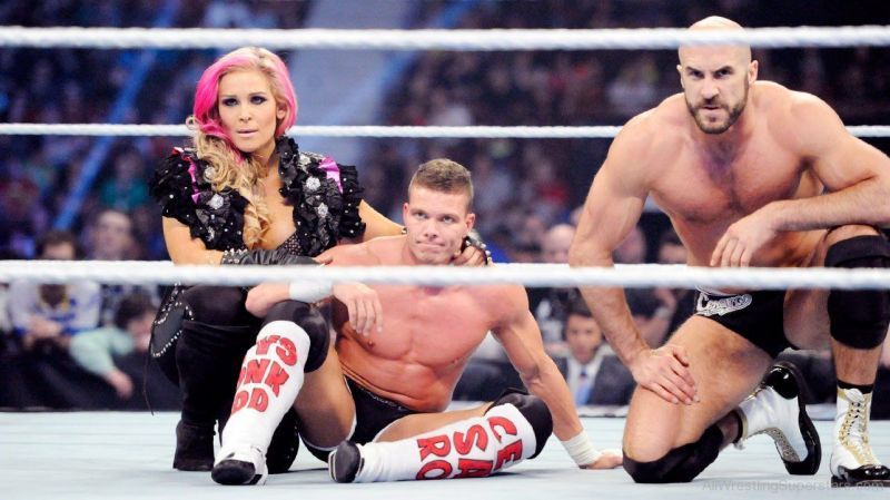 Kidd, with wife Natalya, and Cesaro, whom he held the Tag Team Titles with.