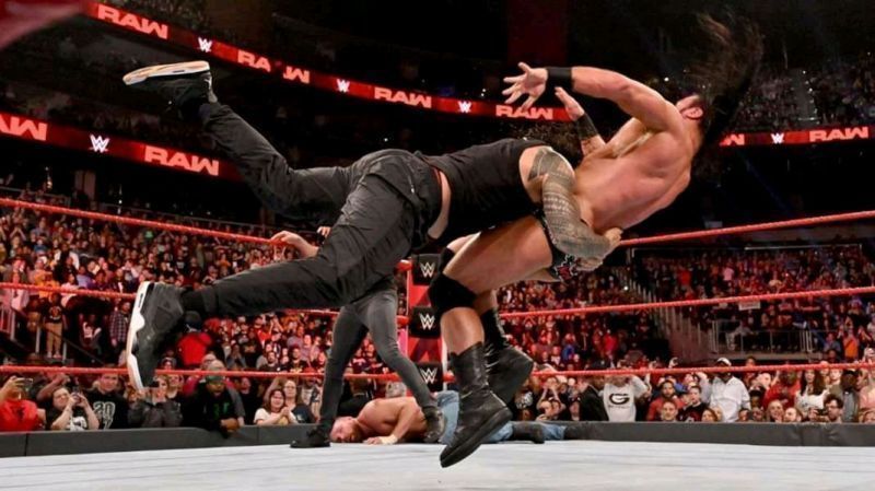 Roman Reigns spears Drew McIntyre